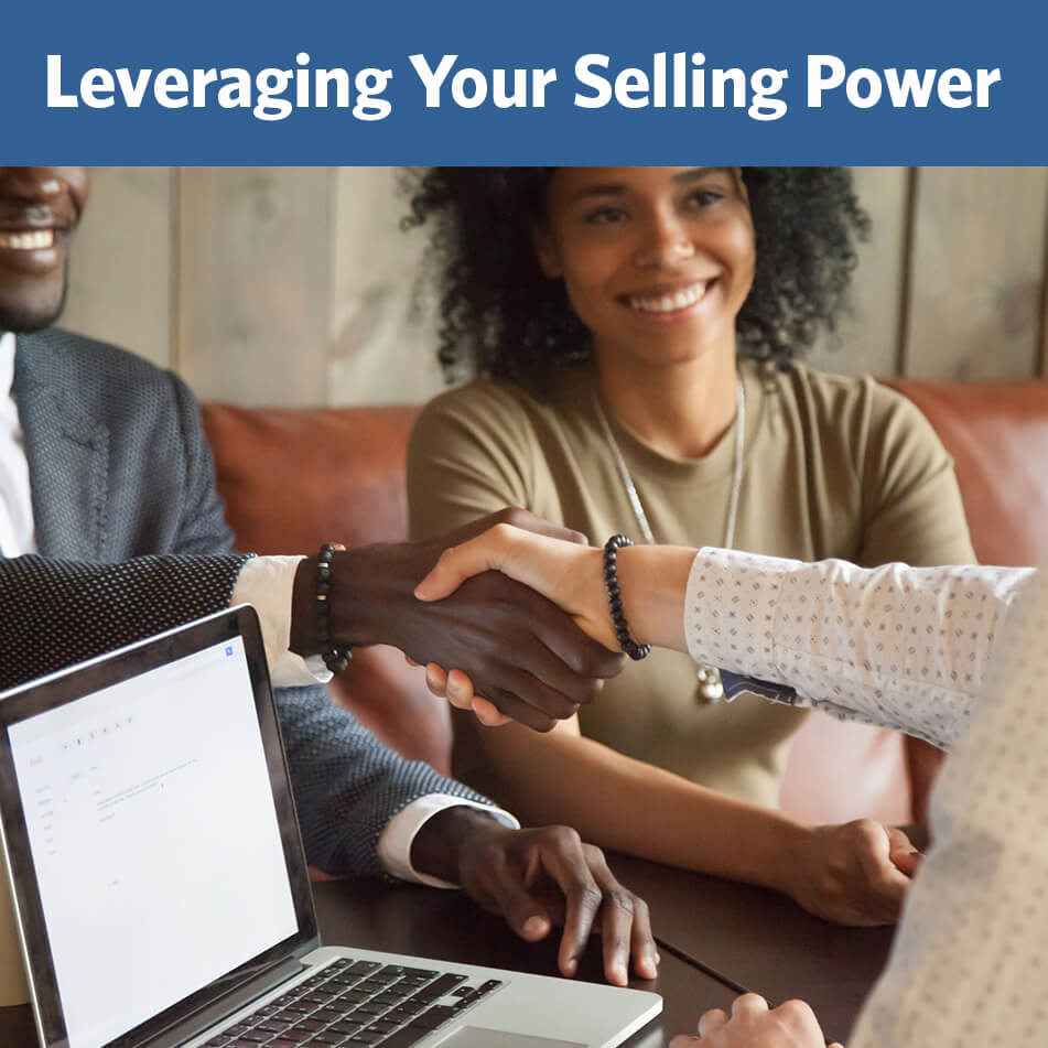 Couple shaking hands with unknown person after making selling their home