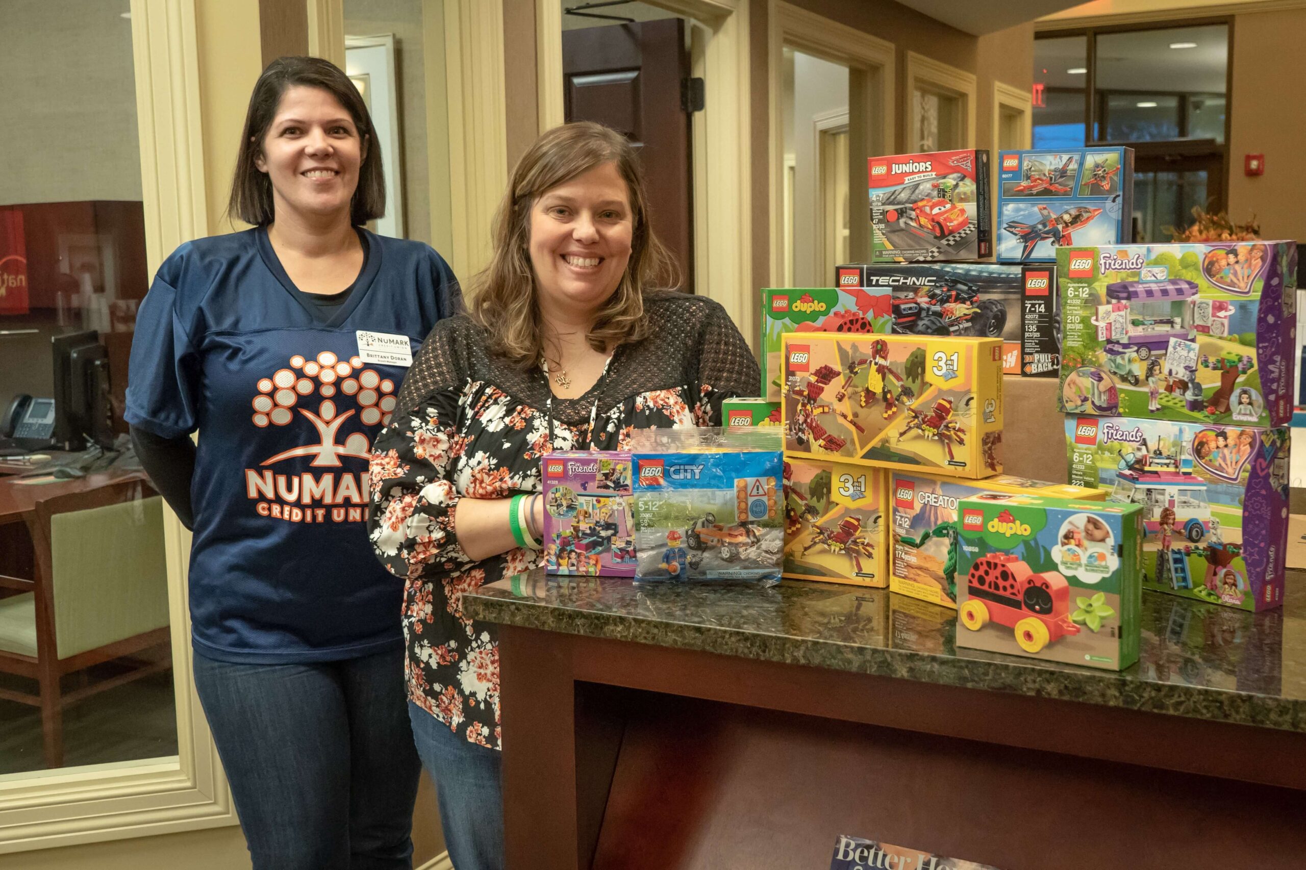 Branch Manager and Team Nicholas member with donated Legos