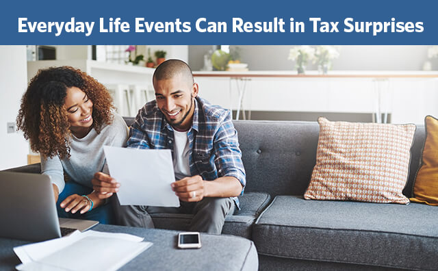 a man and a woman looking at a piece of paper